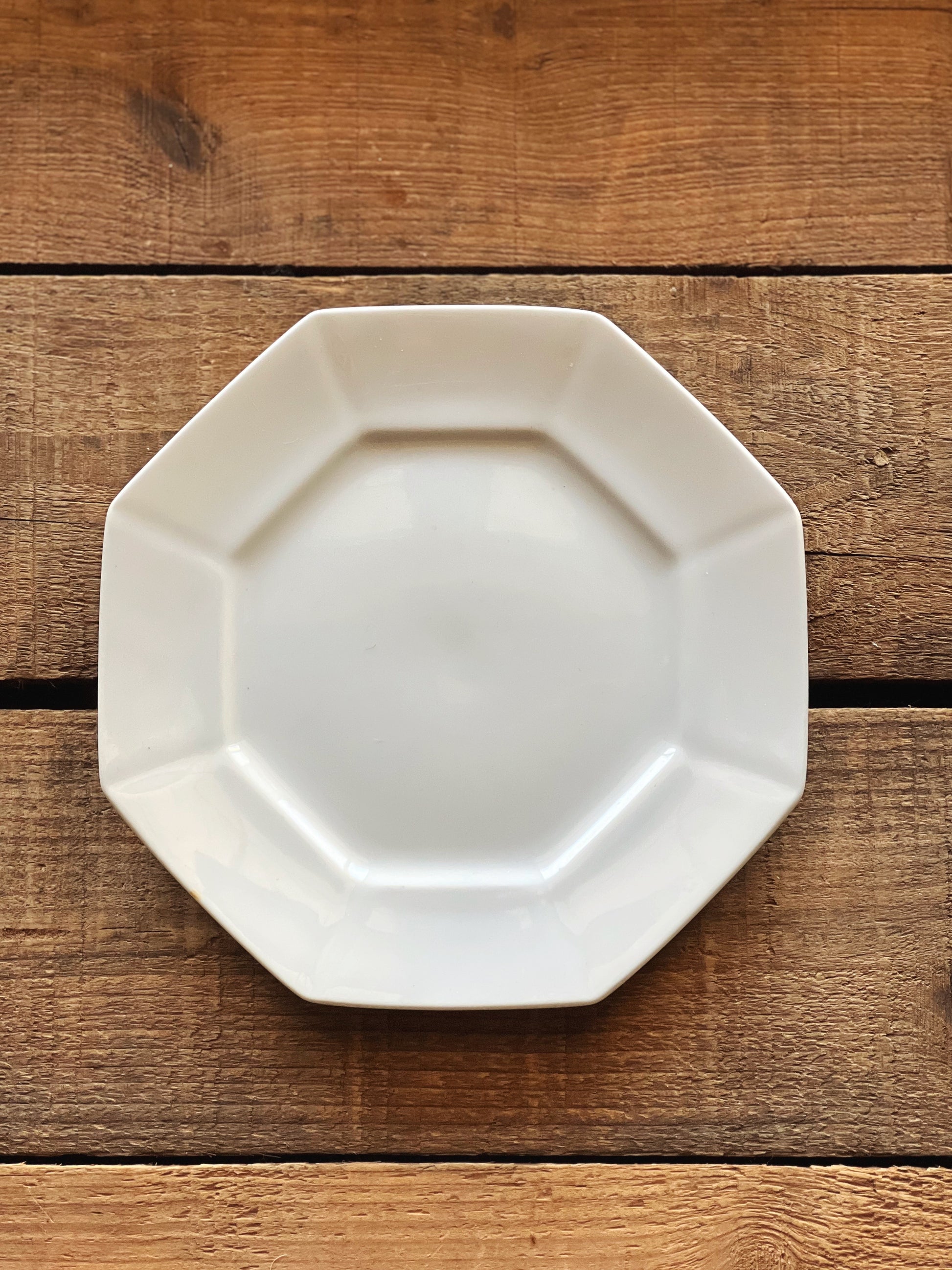 white ironstone plate in an octagonal shape