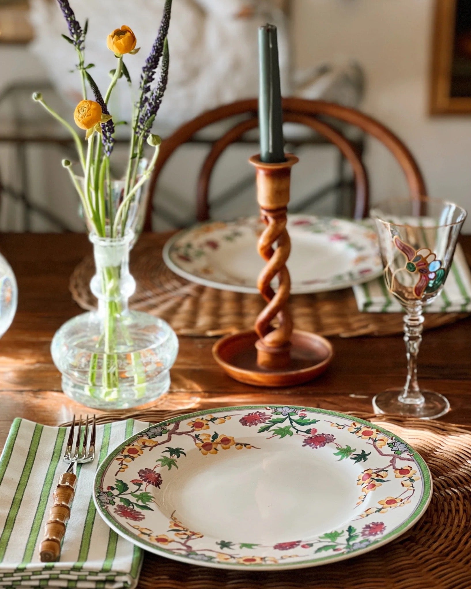 hand painted wine glass with a stained glass look on a table set for spring