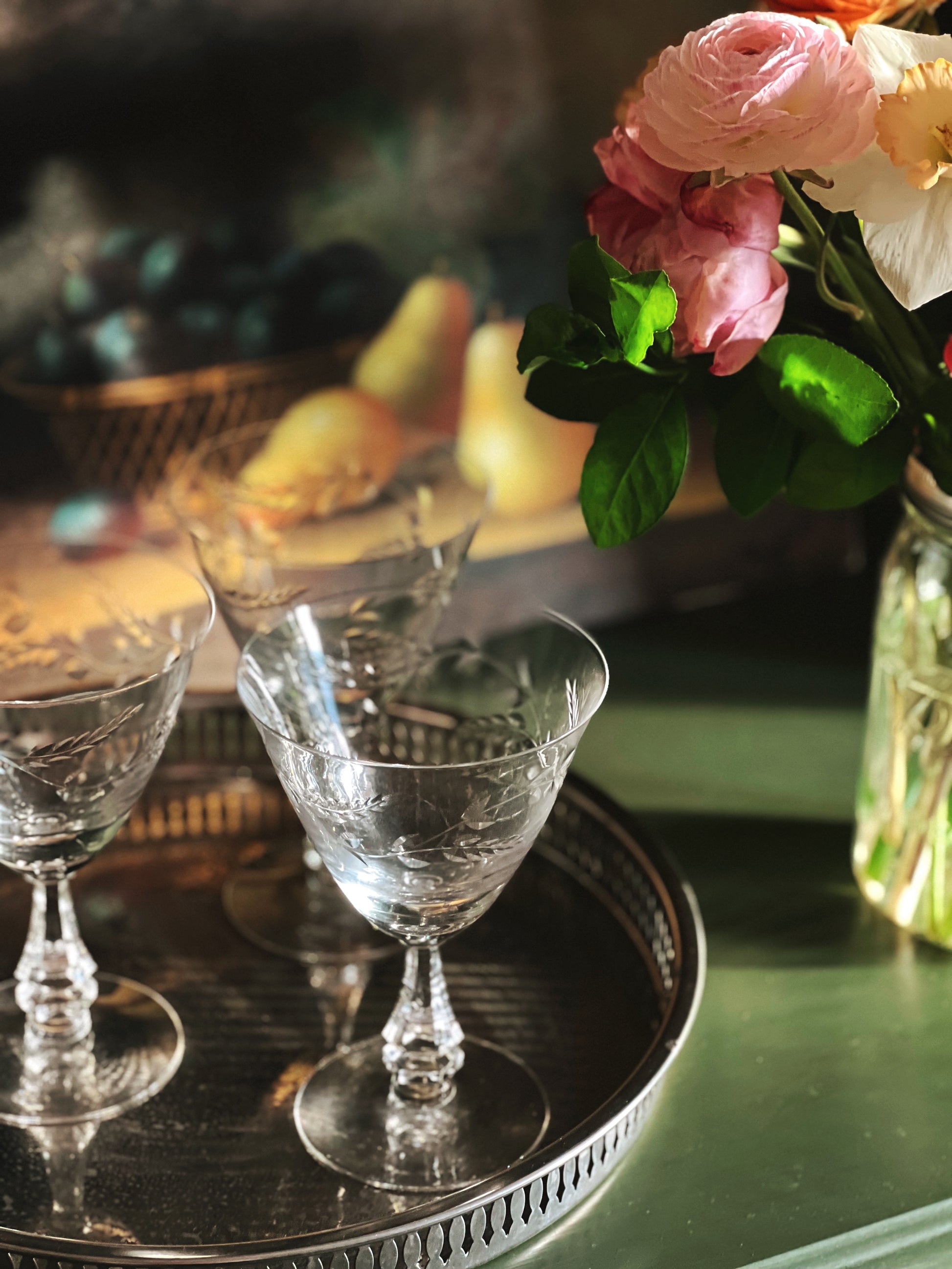 etched crystal wine glasses on a silver tray