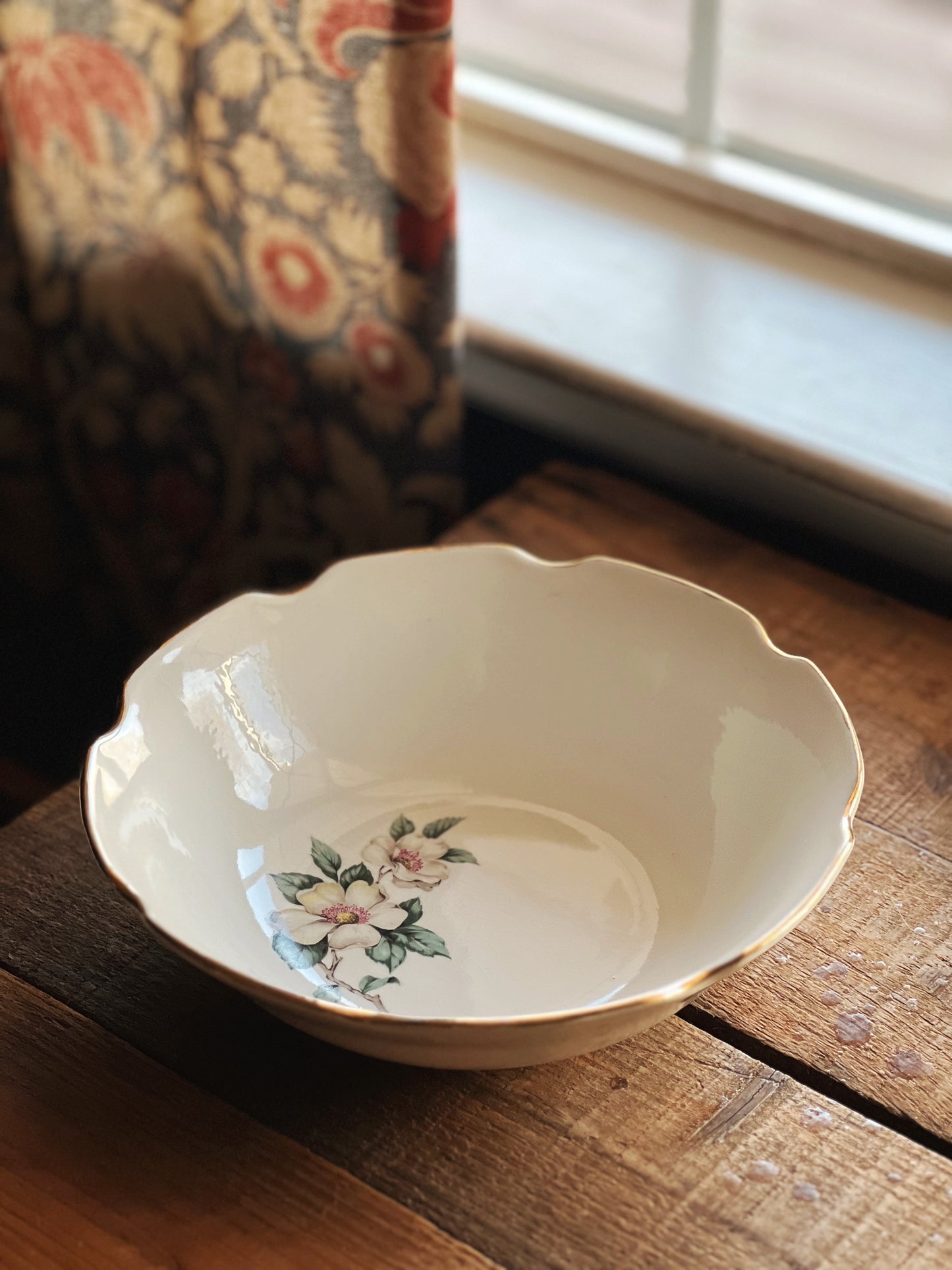 scalloped edge serving bowl with a dogwood flower design
