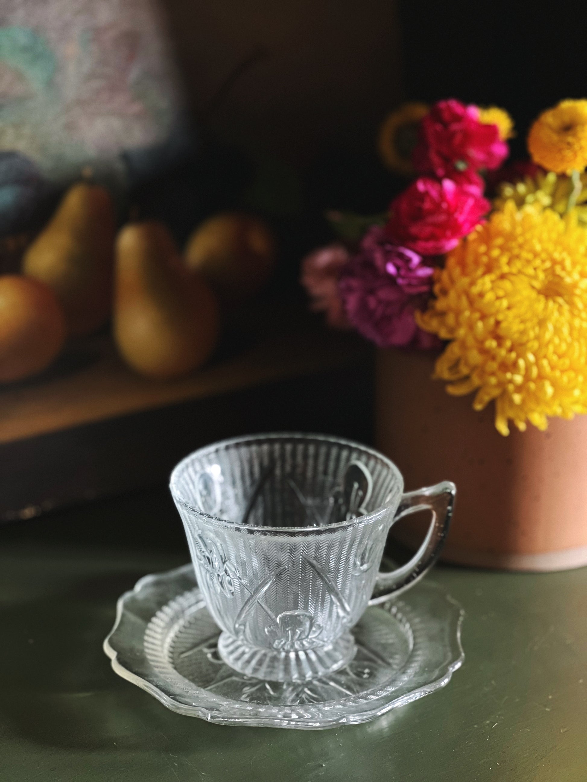 teacup and saucer set with a frosted floral design