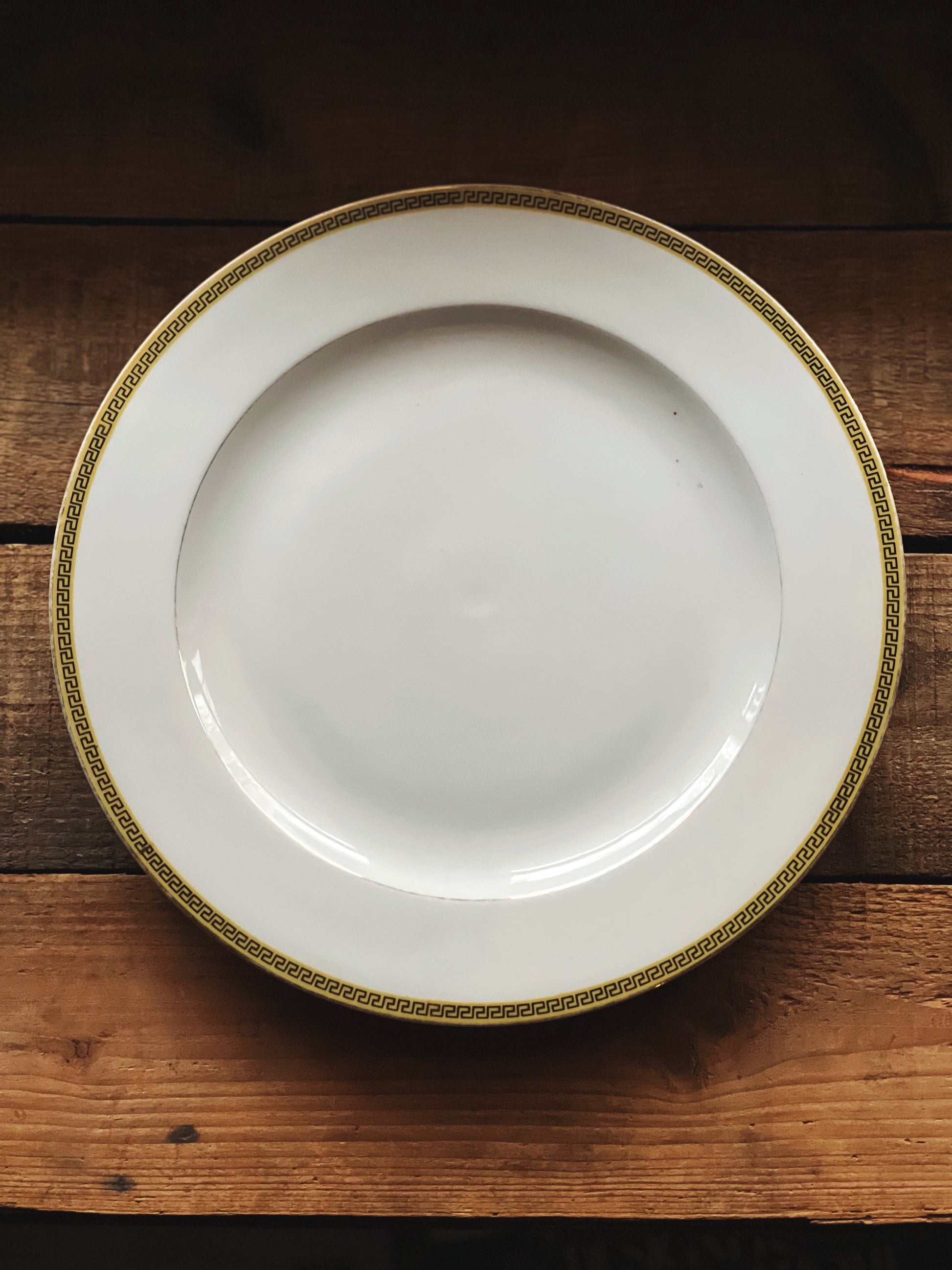 vintage dinner plate with a Greek Key design around the rim