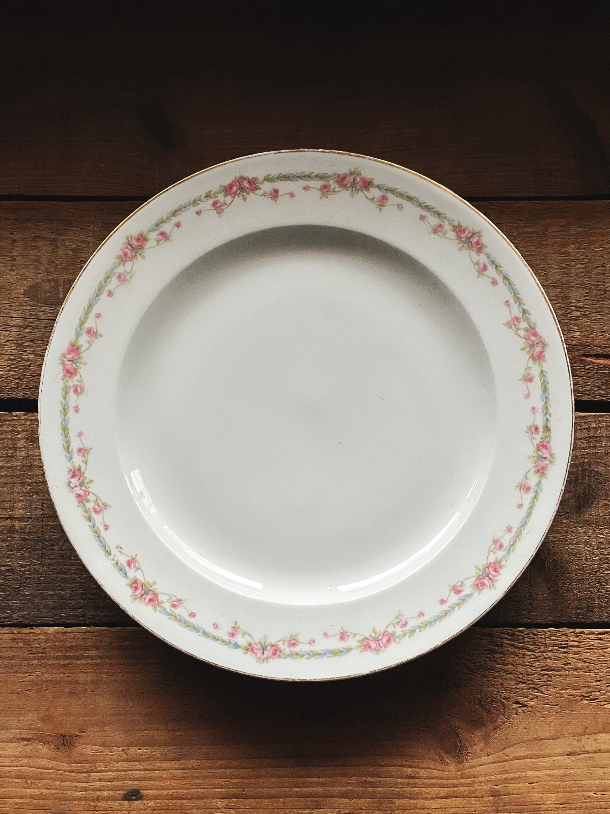 antique Limoges plate with pink floral rim