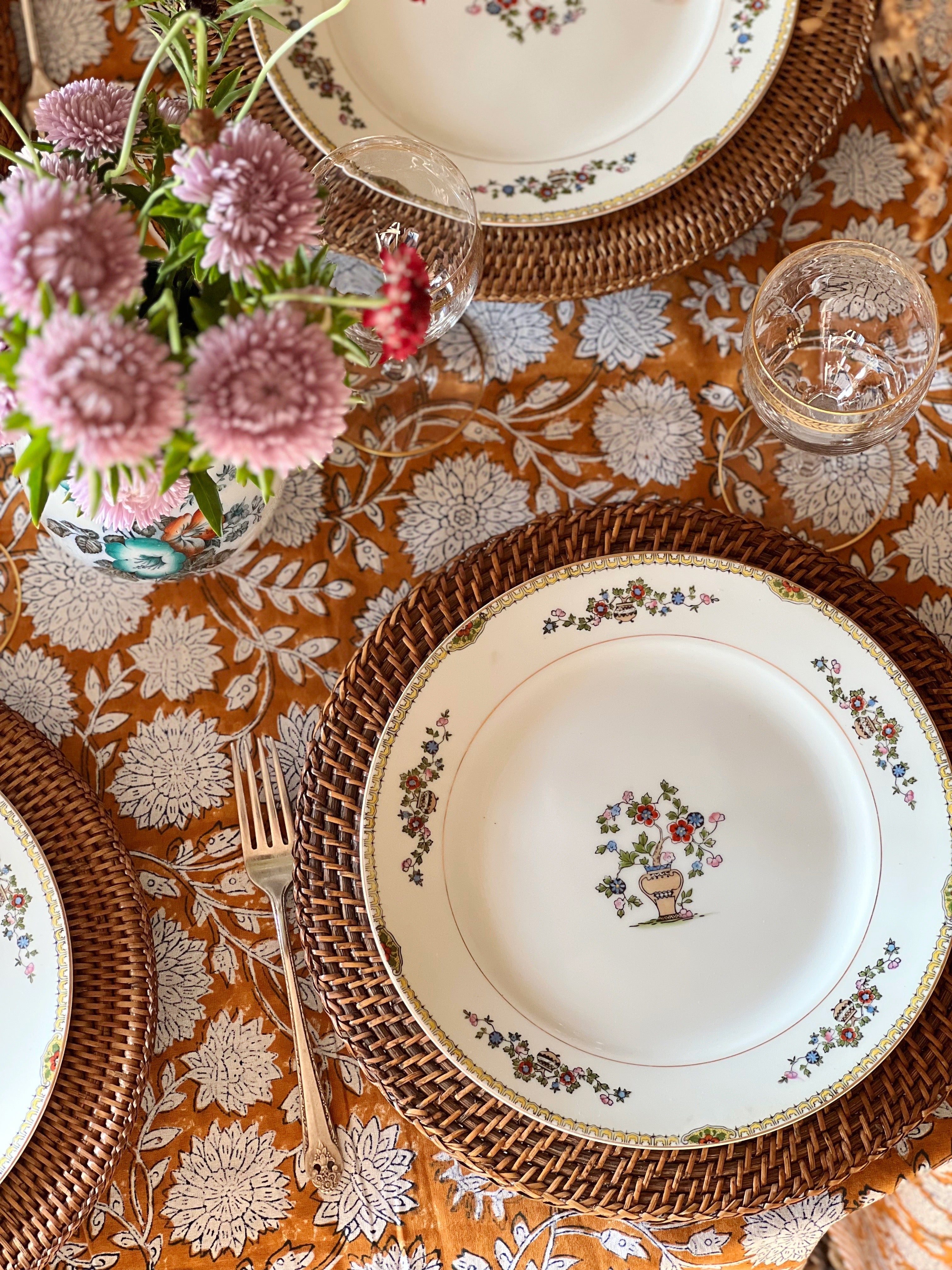 vintage Noritake china and dinnerware with woven chargers and gathered table decor