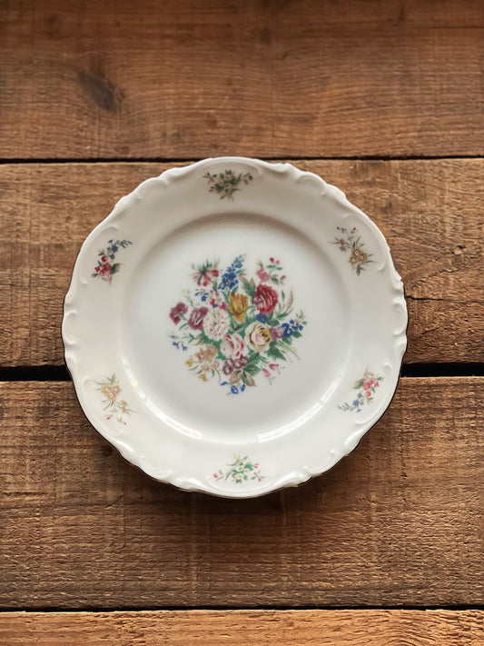 multicolor floral plate with a scalloped edge