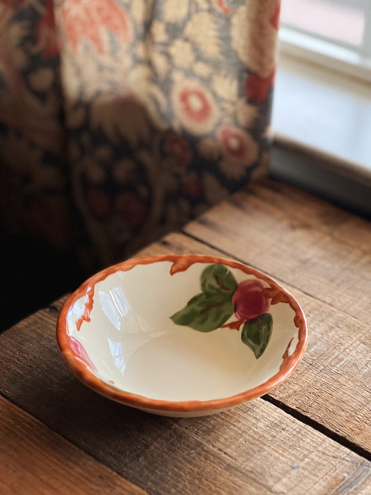 Franciscan Apple bowl on a wooden table