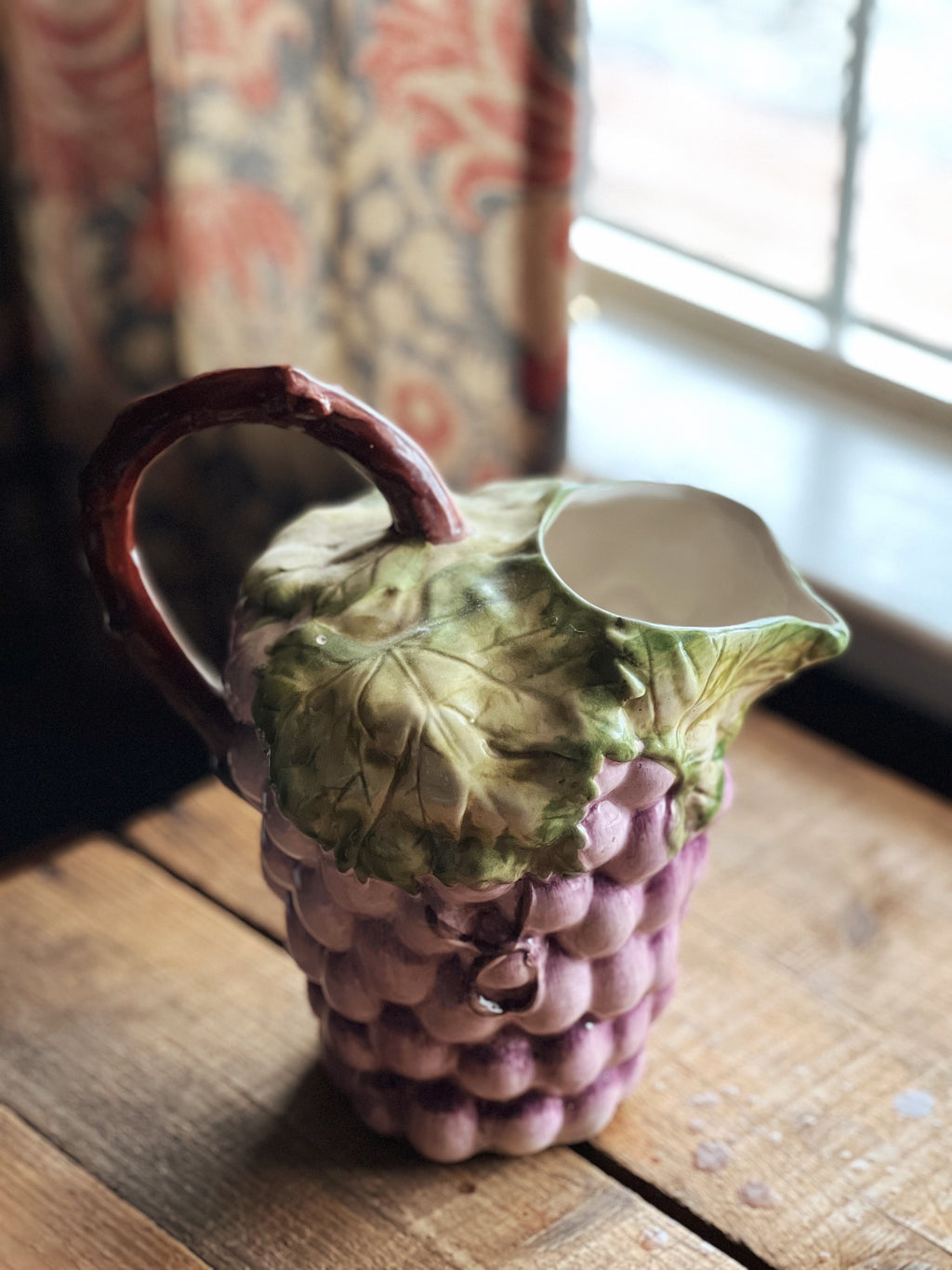 vintage grape cluster pitcher with a faux bois handle
