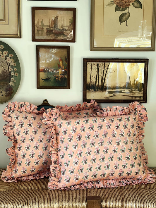 pink and green block print throw pillows with a ruffled edge