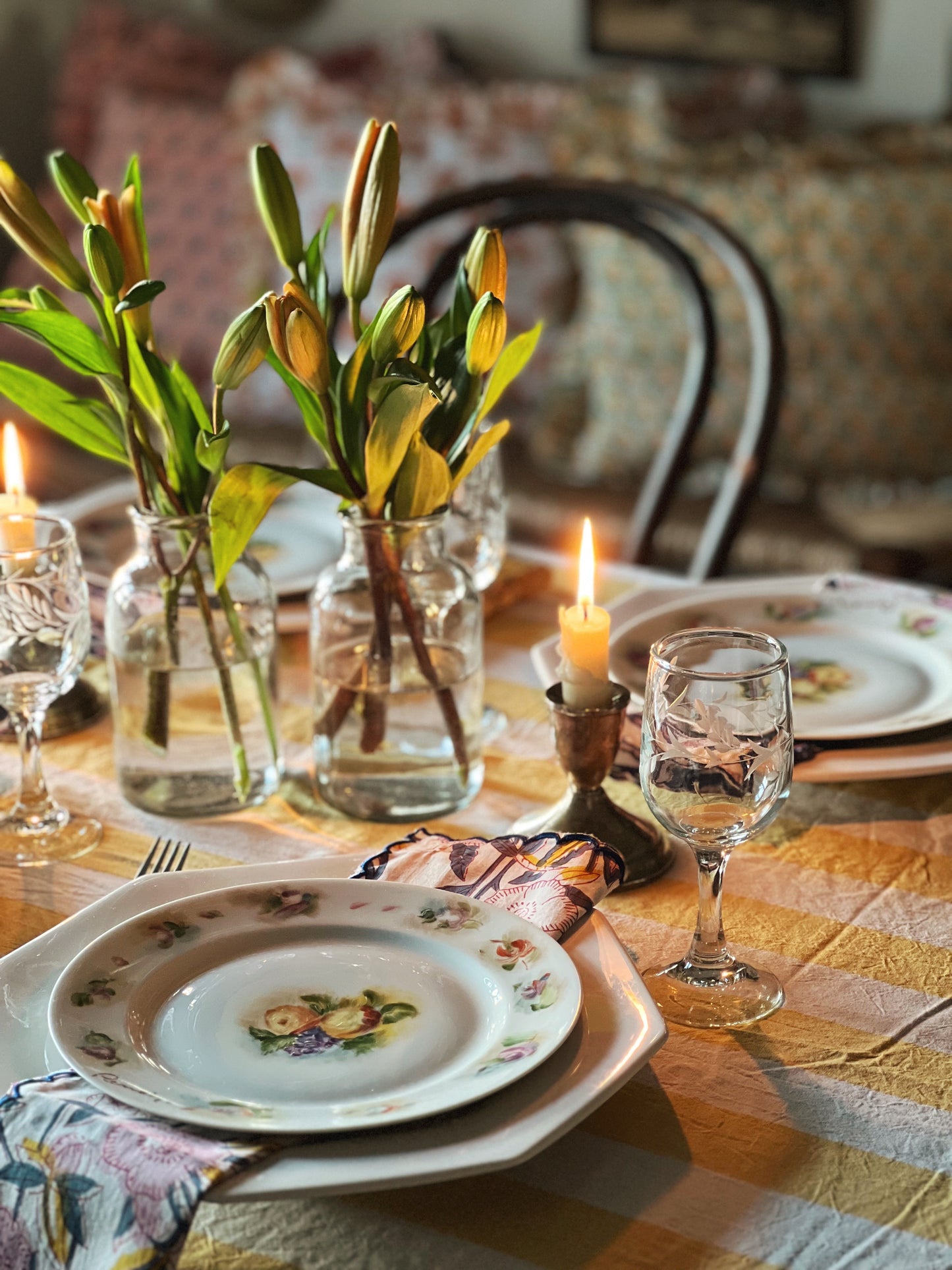 etched wine glasses on a table set for spring