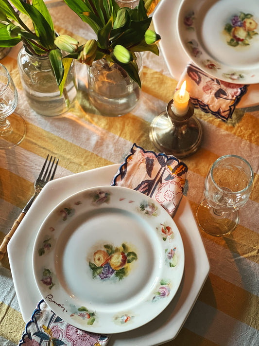 table set with an octagonal dinner plate topped with a round salad plate