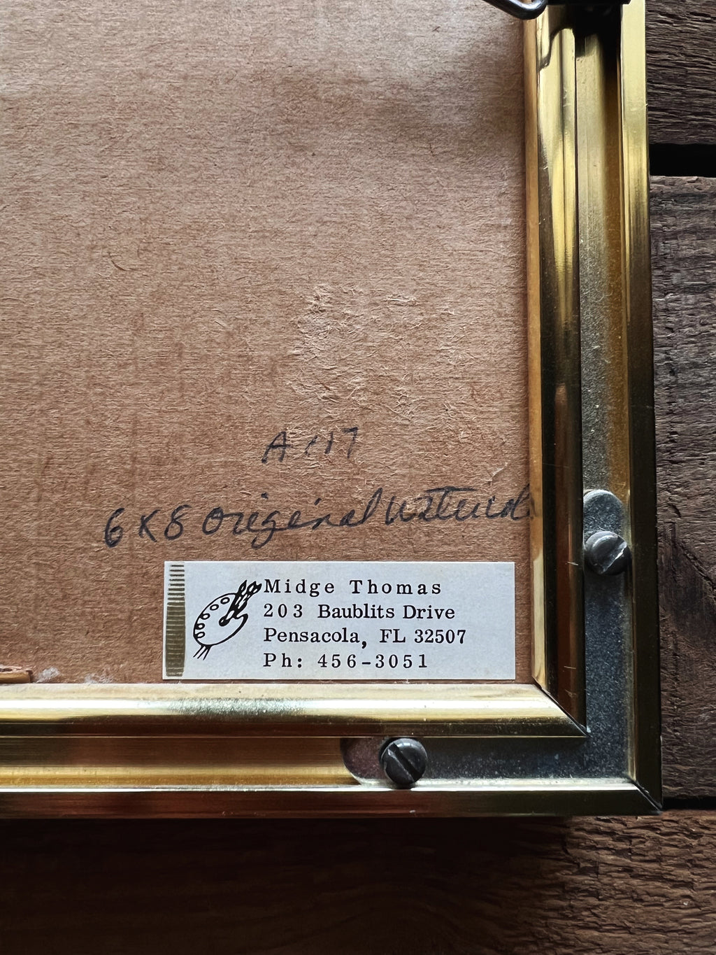 artists marking on the back of a framed and Signed Midge Thomas Sand Dune Watercolor 