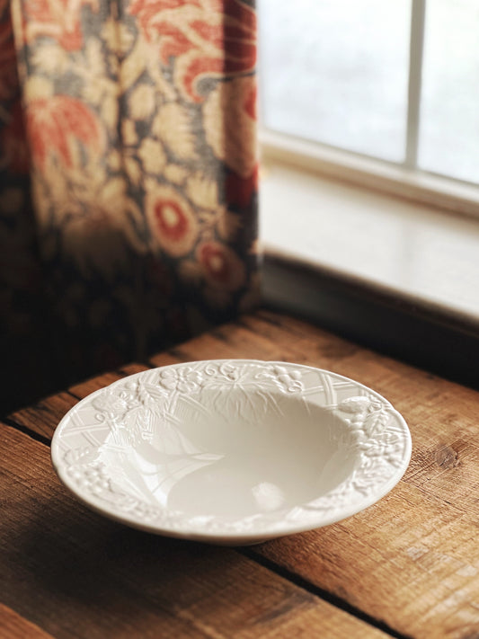 white fruit bowl with an embossed rim