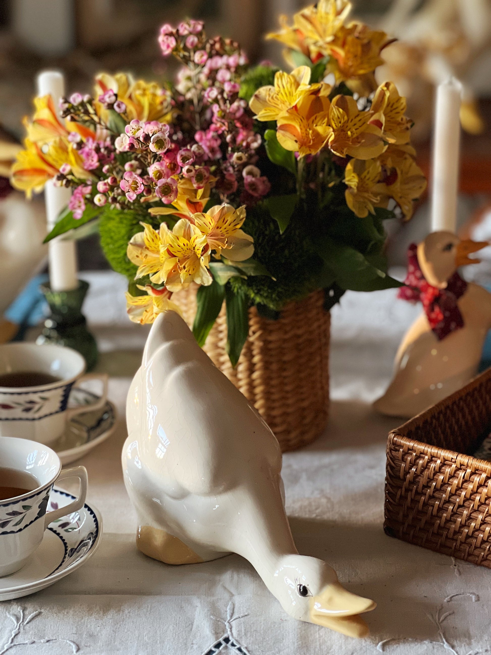 leaning ceramic duck on a spring table