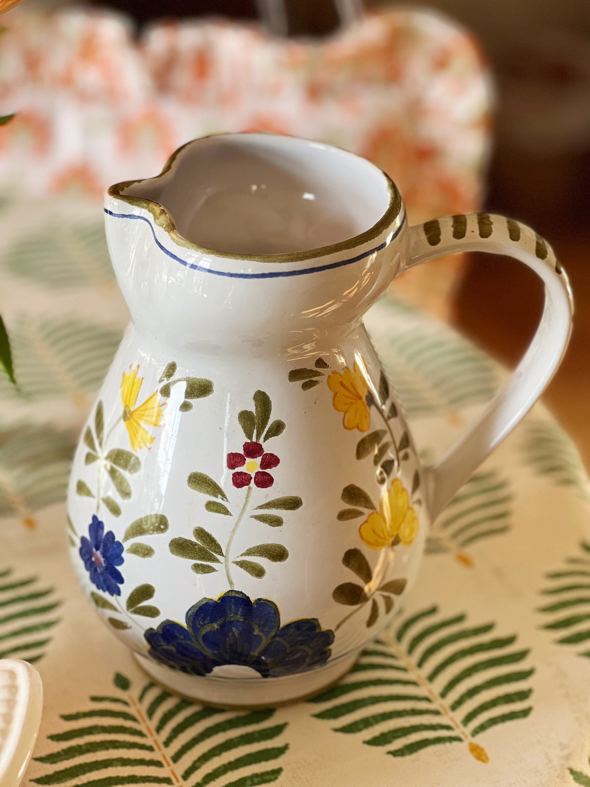 hand painted pitcher in blue, green, red and yellow