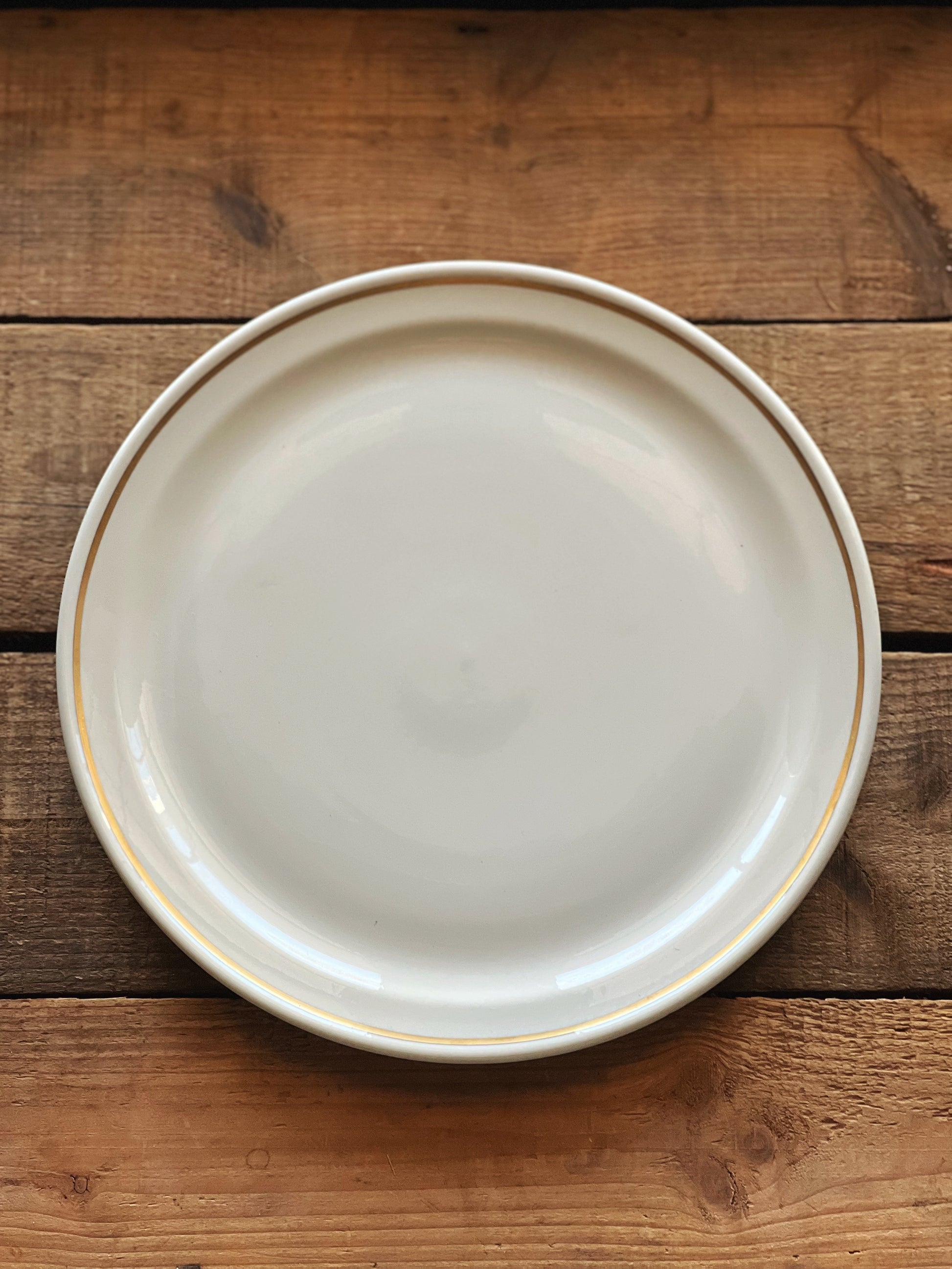 white china with a gold banded rim