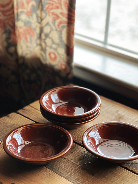 small brown stoneware berry bowls on a table