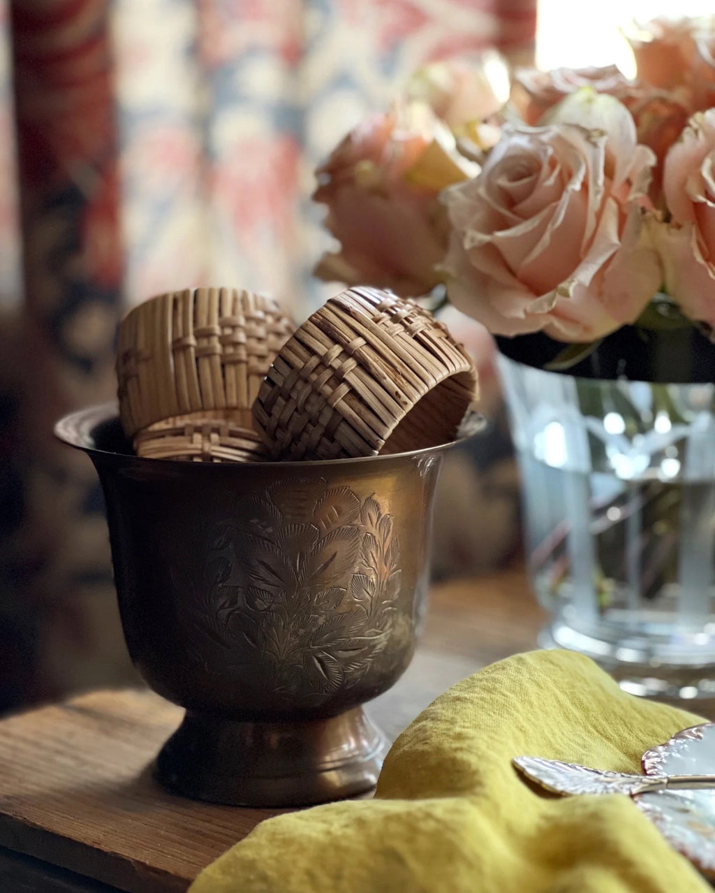 engraved brass planter full of napkin rings