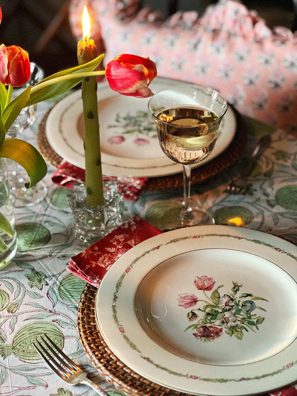 clear glass candleholders on a table set for spring