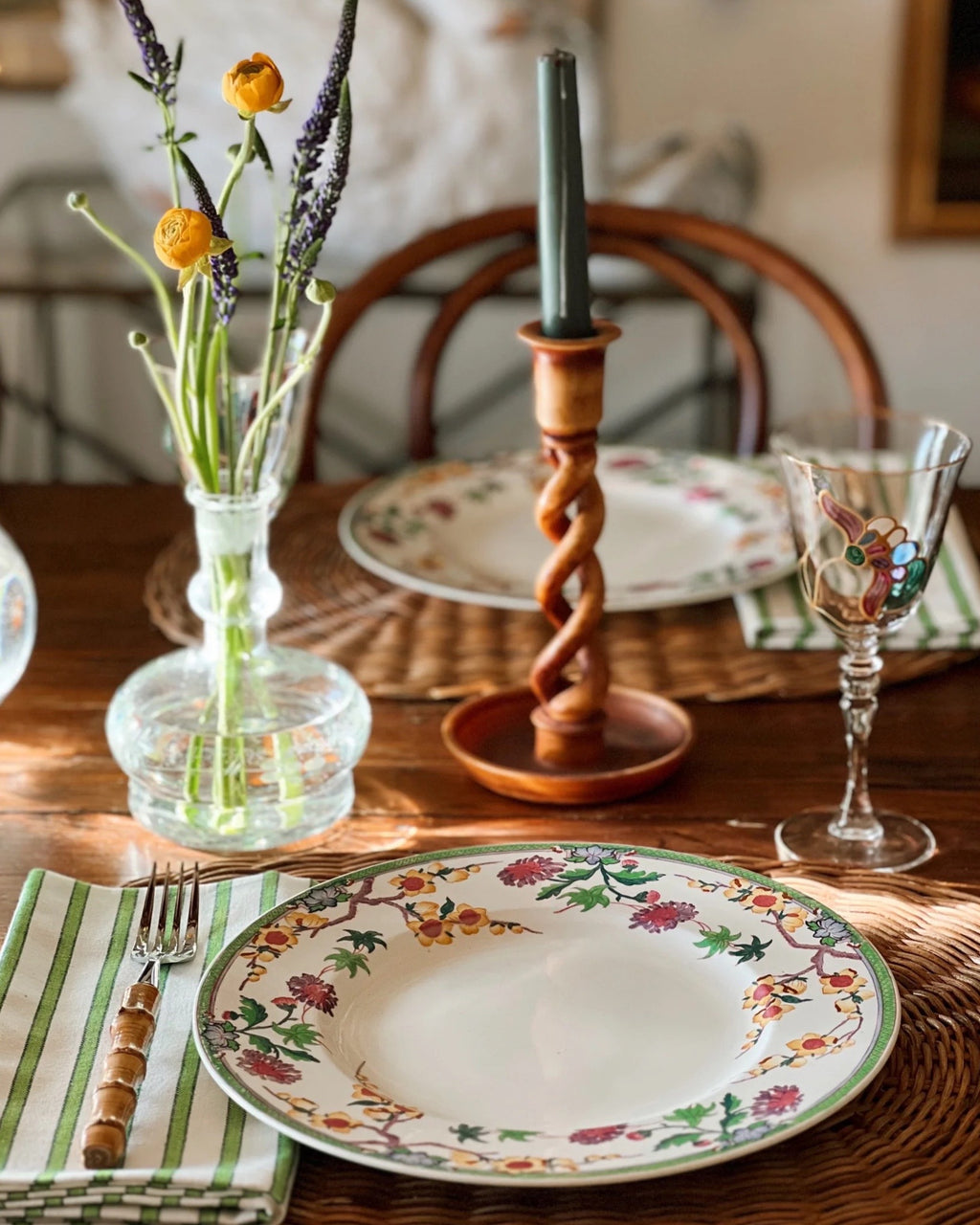 hand painted wine glass with a stained glass look on a table set for spring