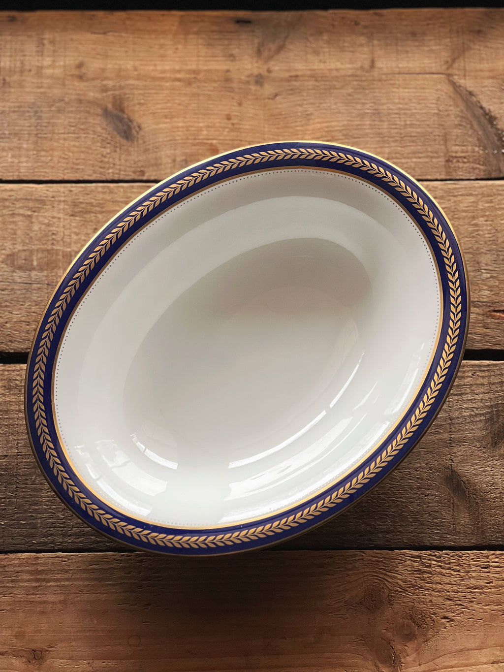 navy rim oval vegetable bowl