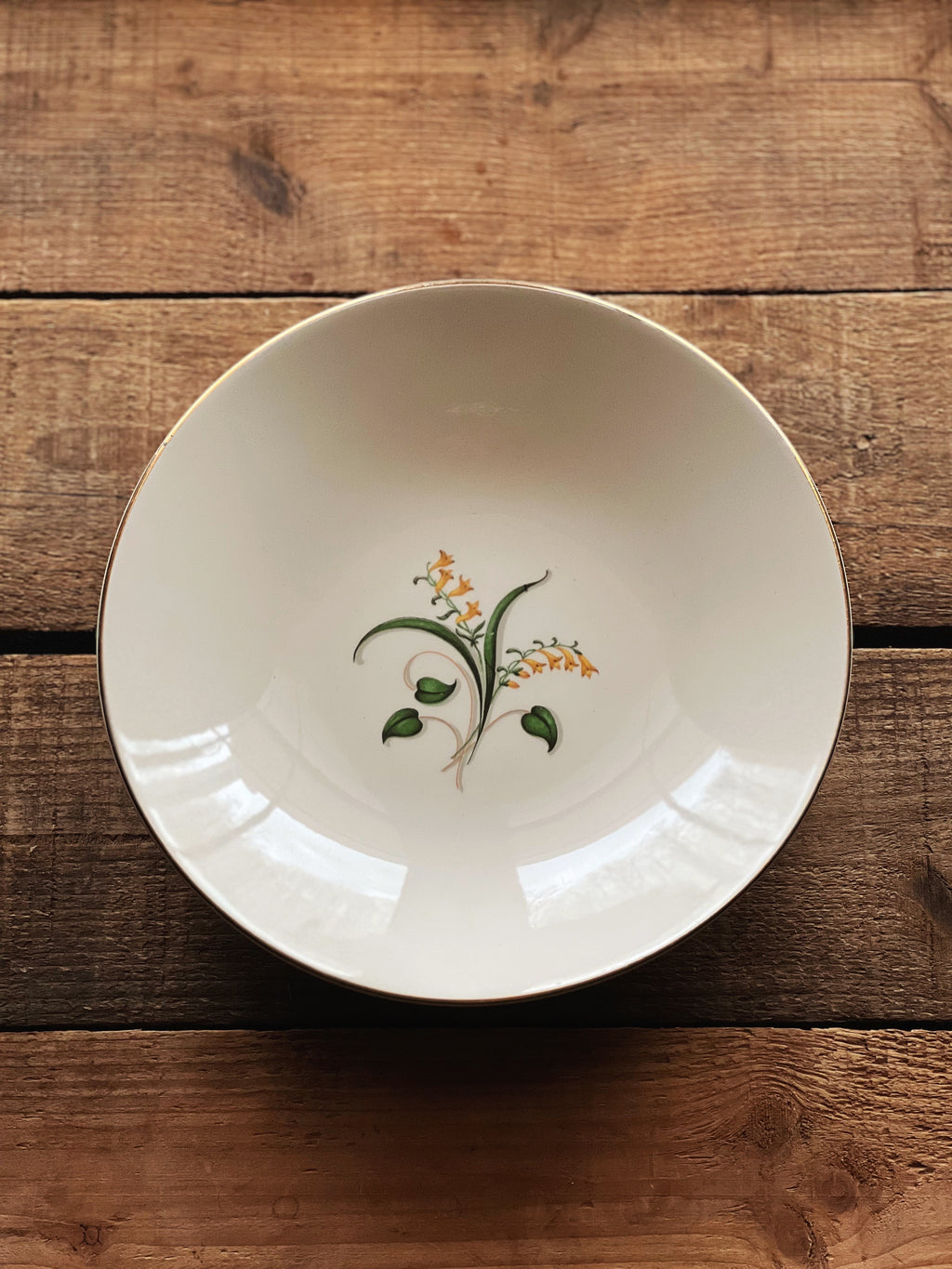 forsythia design soup bowl with a gold rim 