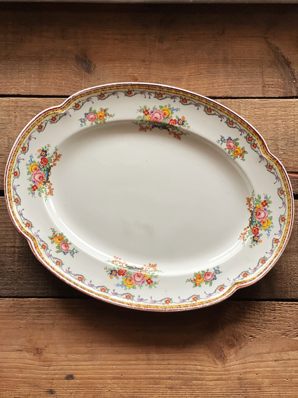 multicolor floral platter with a garland design rim