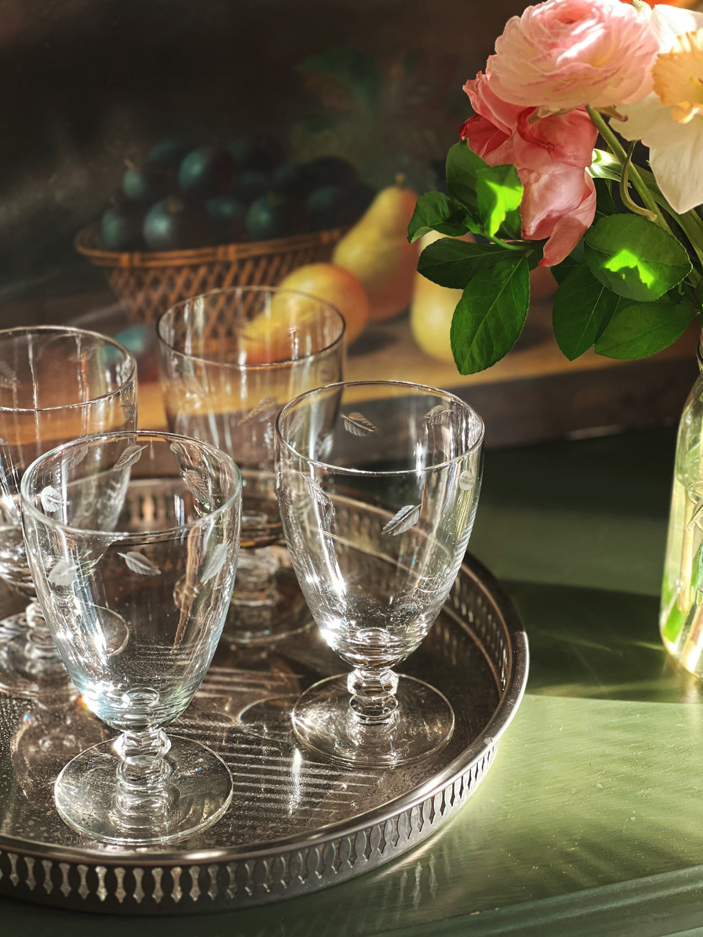 etched water glass with a leaf design