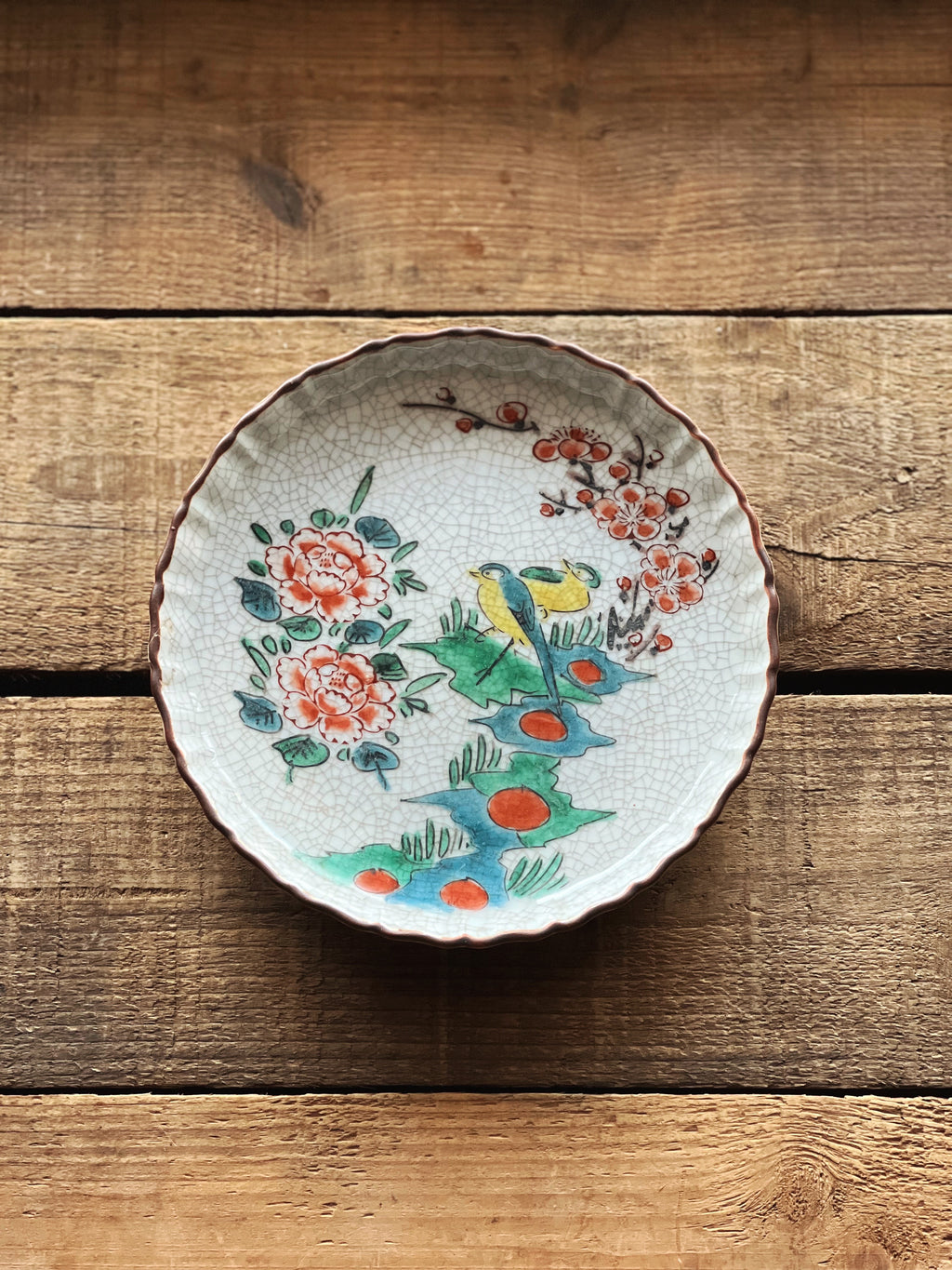small decorative dish with bird design