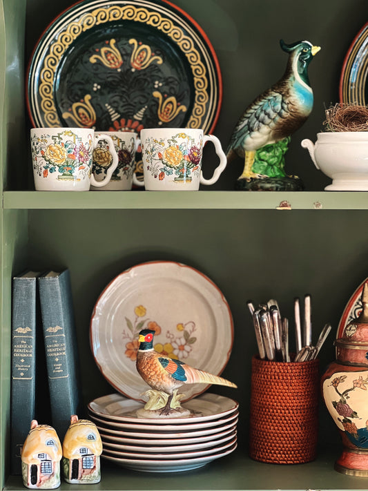 green vintage transferware mugs on a shelf