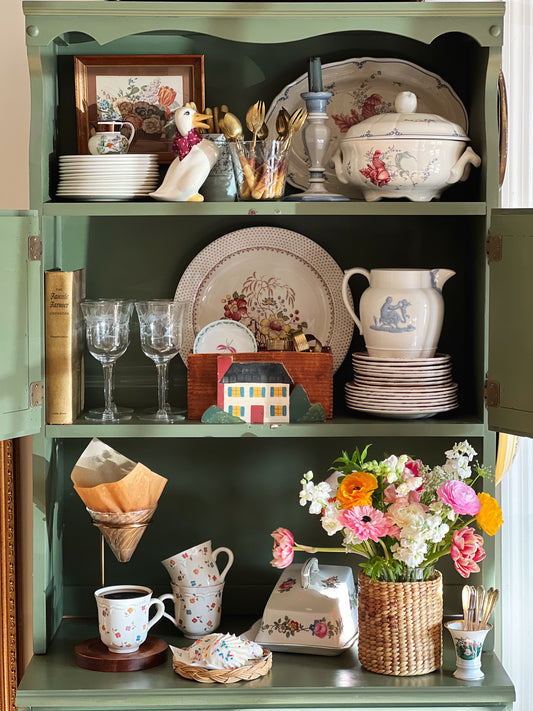kitchen dresser full of assorted dishes