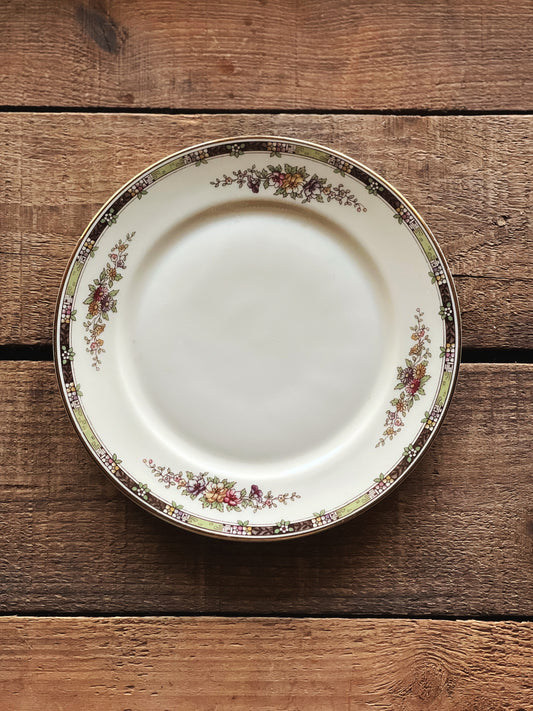 multicolor floral dessert plate with black accents