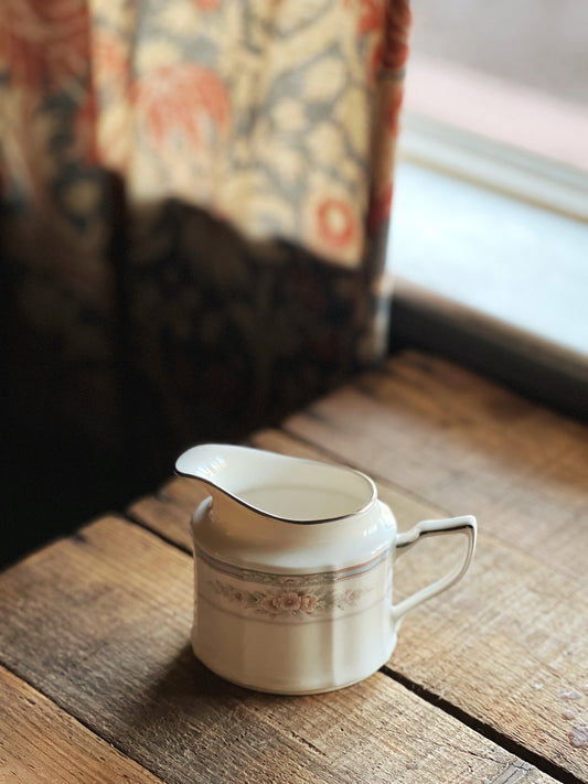 pink and blue floral creamer