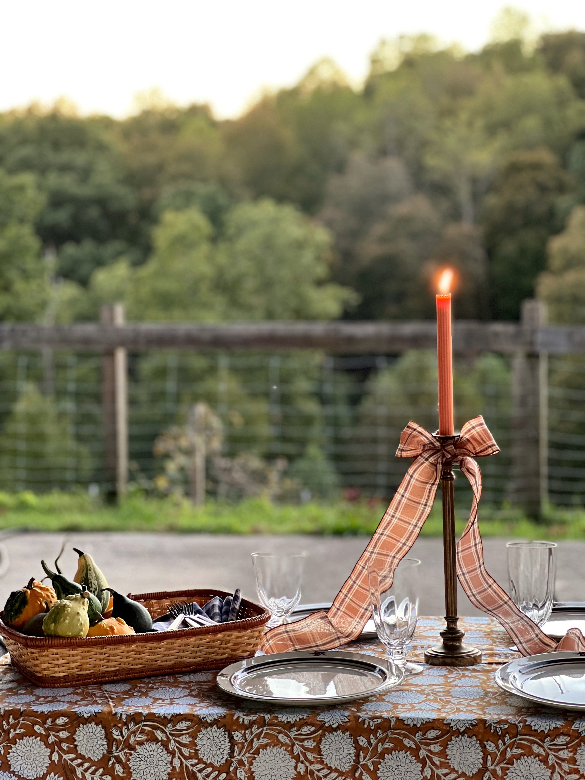 mix match wine glasses set on an outdoor autumn table