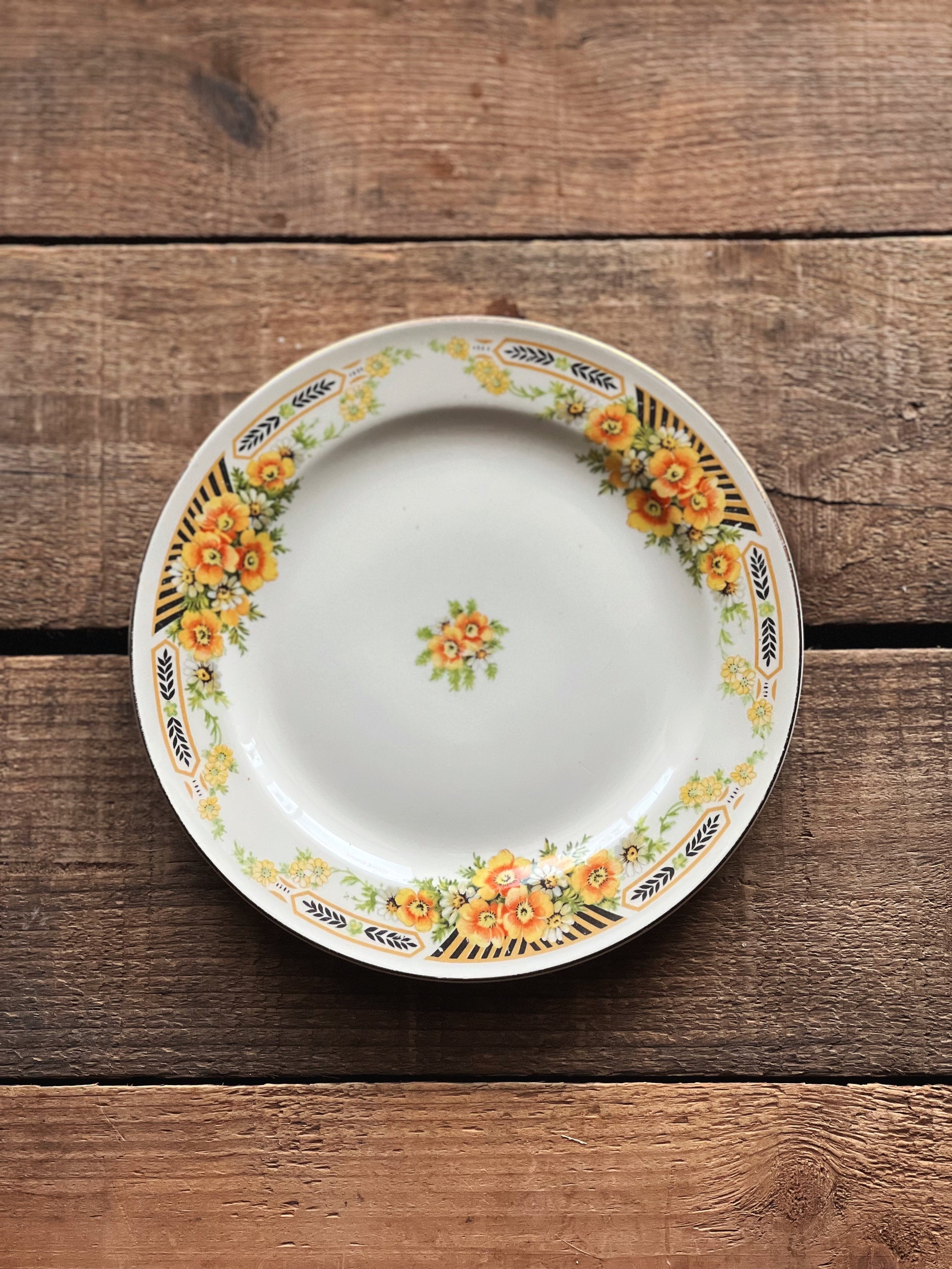 black and yellow floral dessert plate
