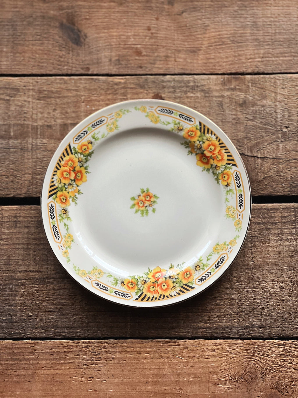 black and yellow floral dessert plate
