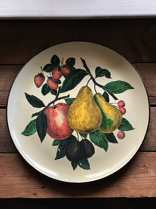 round serving tray with a fruit pattern design