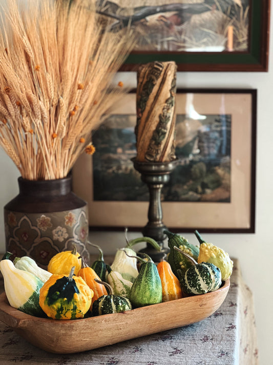 vintage dough bowl filled with gourds