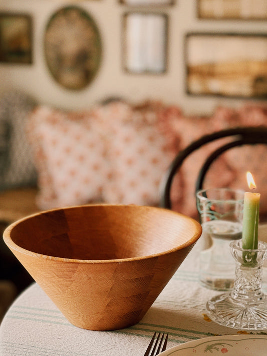 rustic oak wood salad bowl on a table