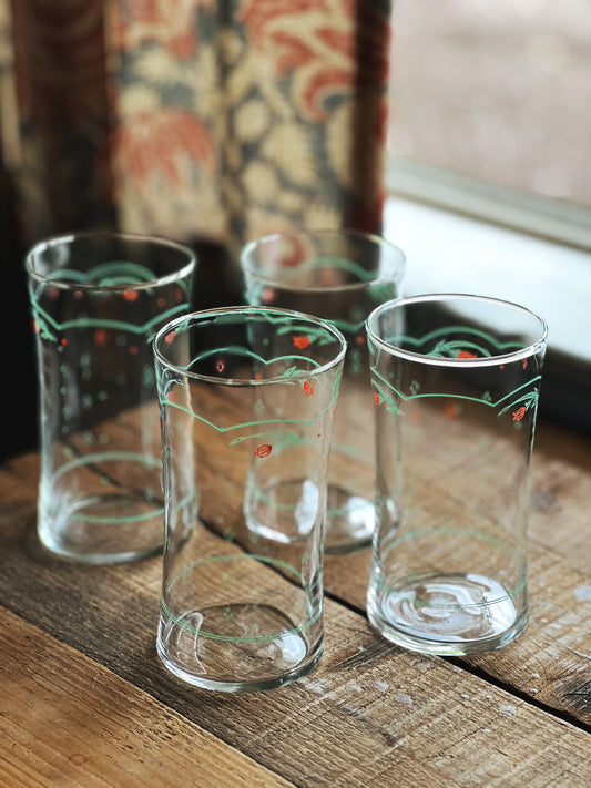 set of 4 vintage glasses with a pink and green floral design