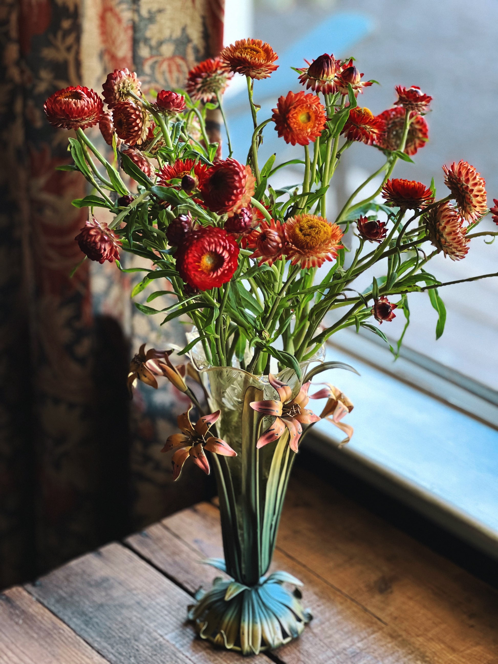 glass and metal flower vase