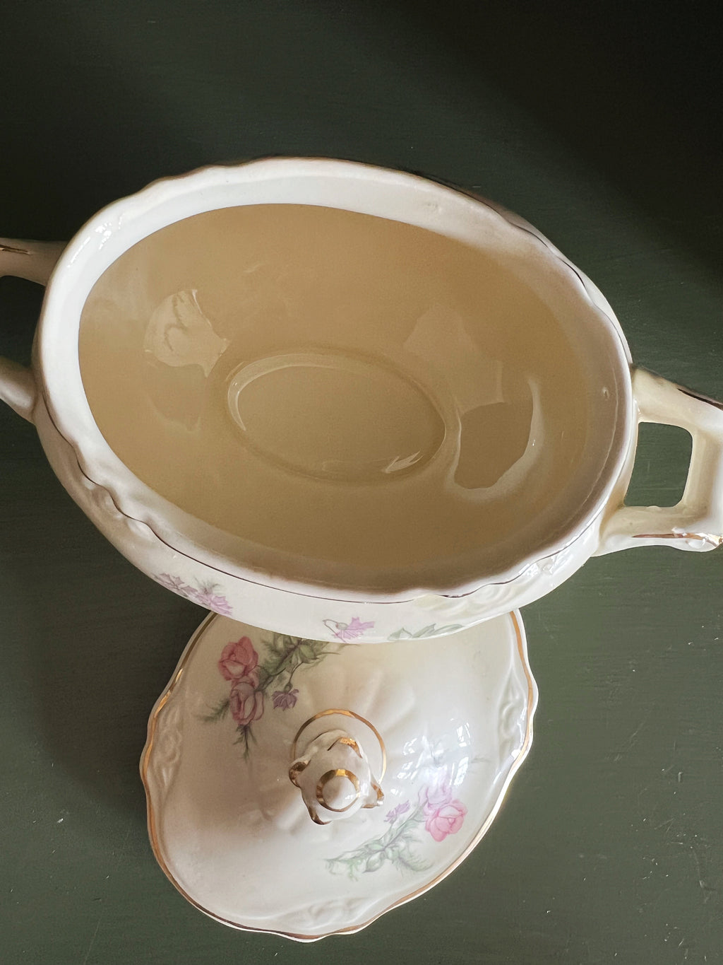 Top view of floral sugar bowl with lid removed and Interior of vintage sugar bowl showing condition