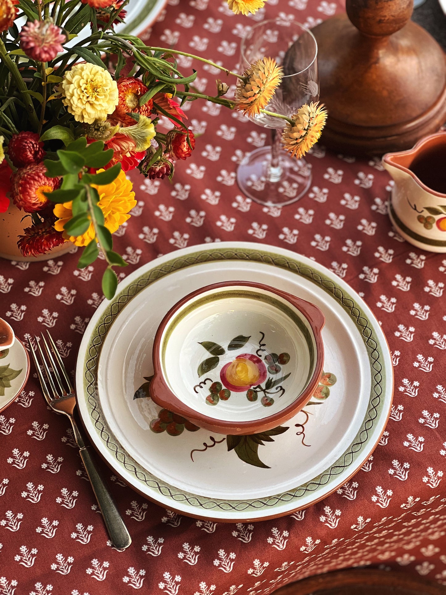 vintage soup bowl with handles on a table outside in fall