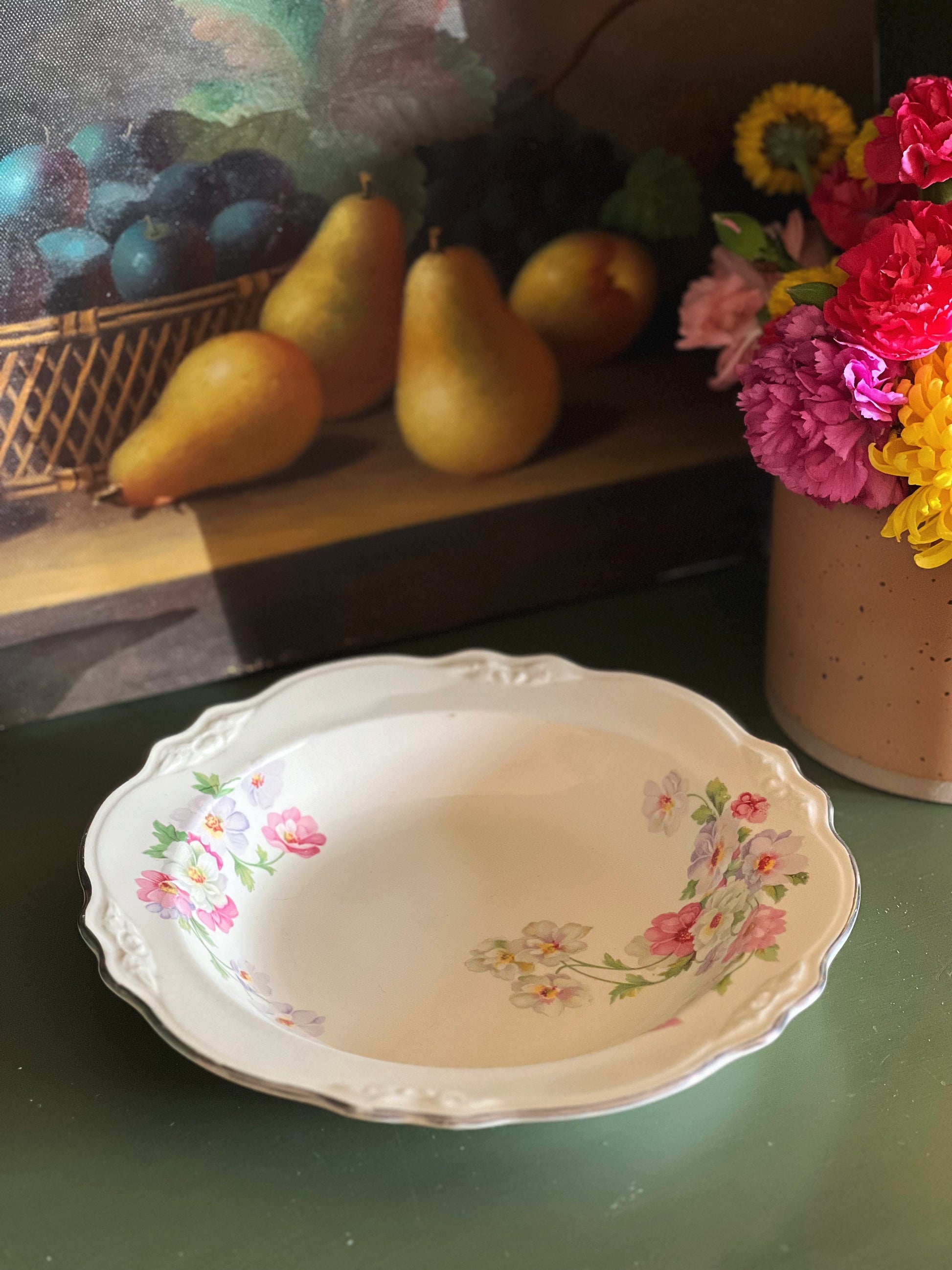 pink, white and green rimmed soup bowl