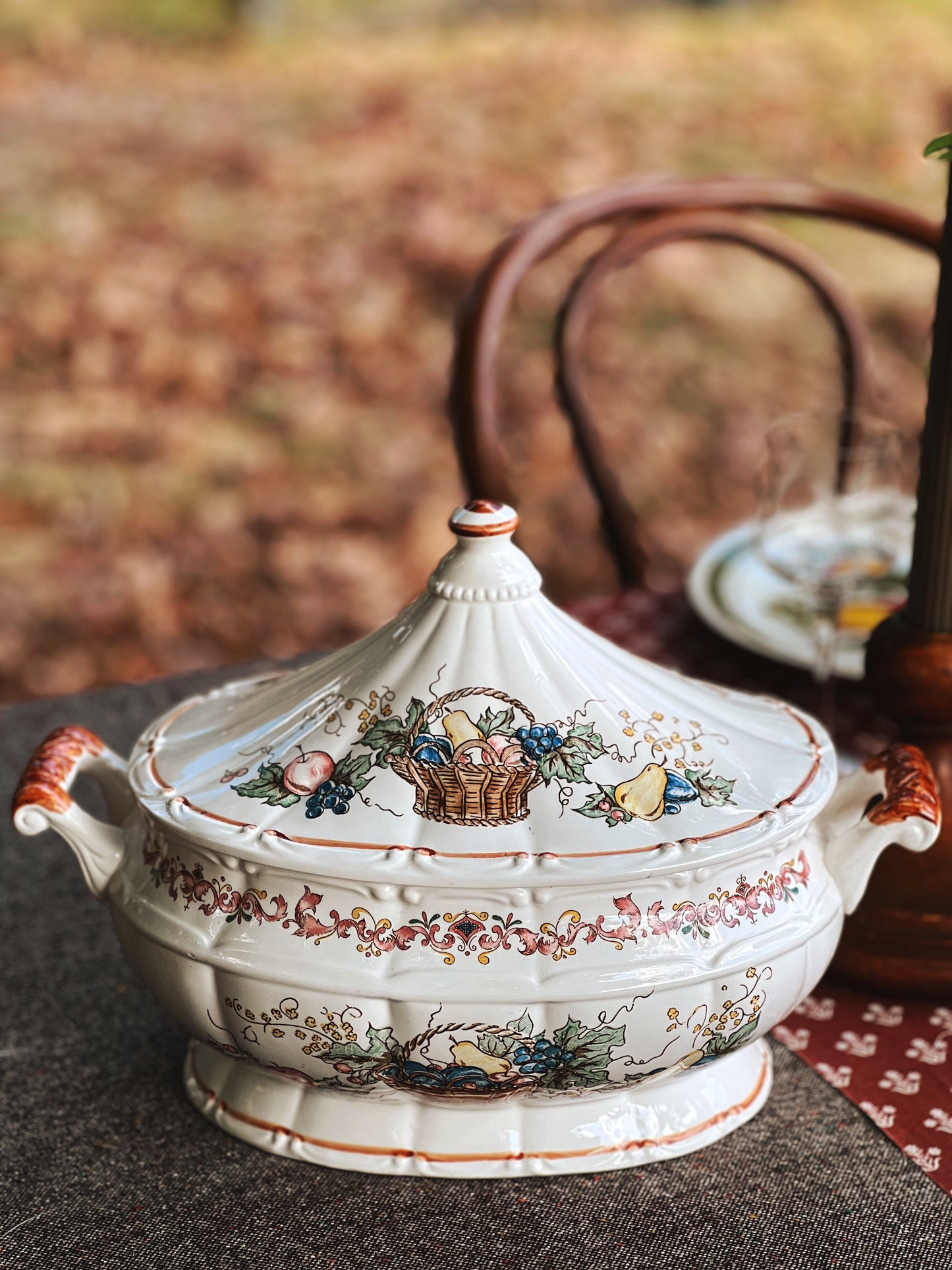 hand painted tureen on a table outside in the fall