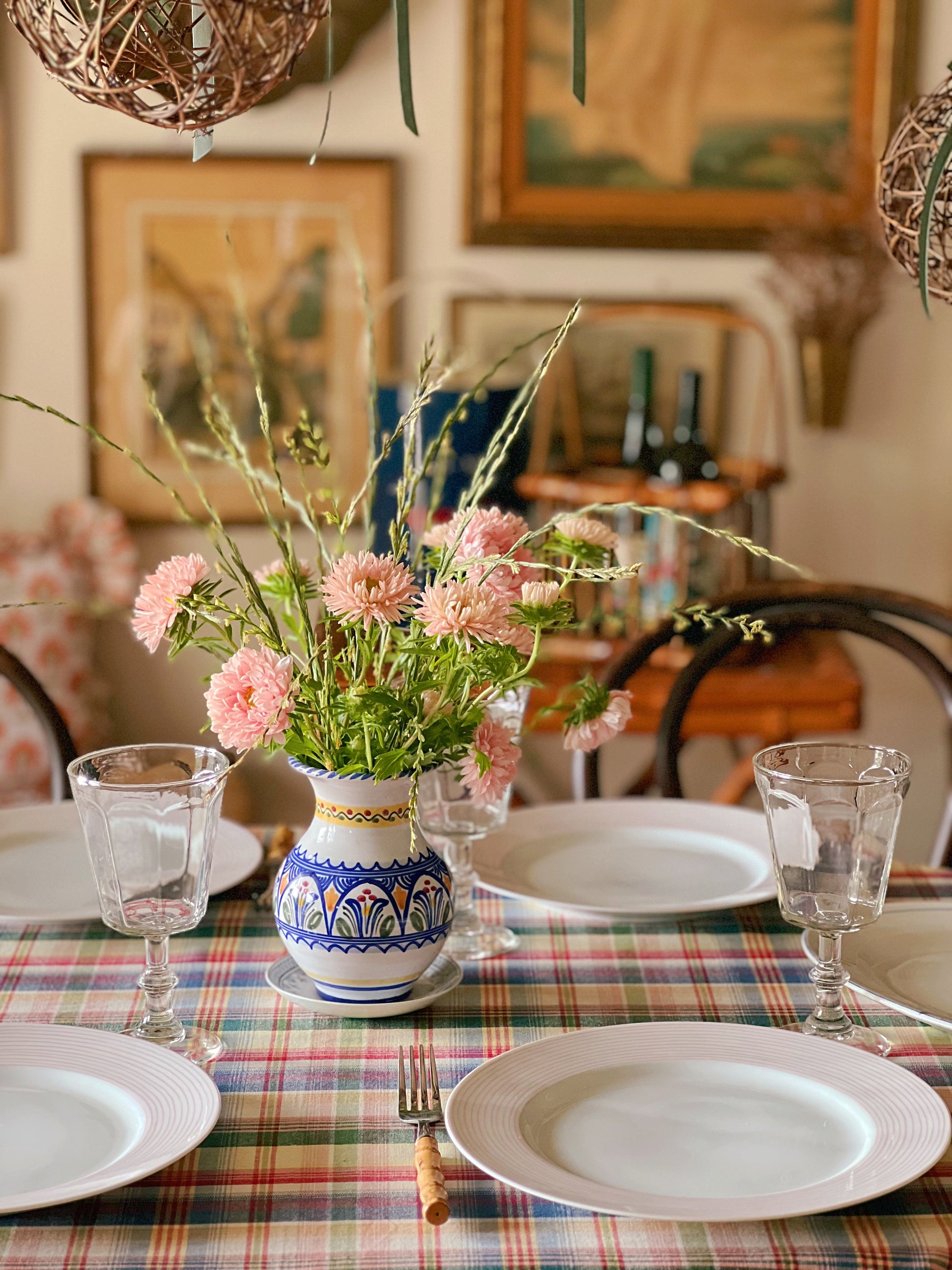 blue and white hand painted vase on a dinner table
