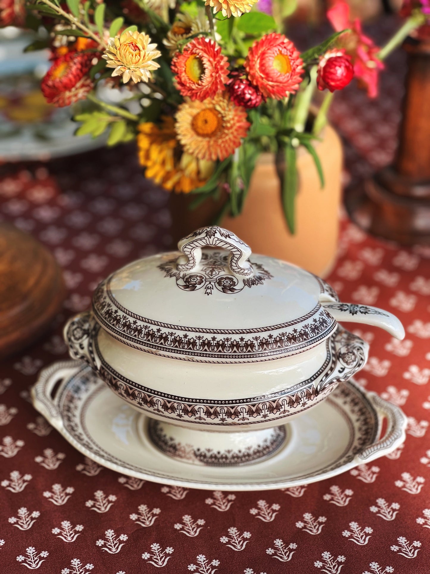 transferware gravy boat on a table outside in fall