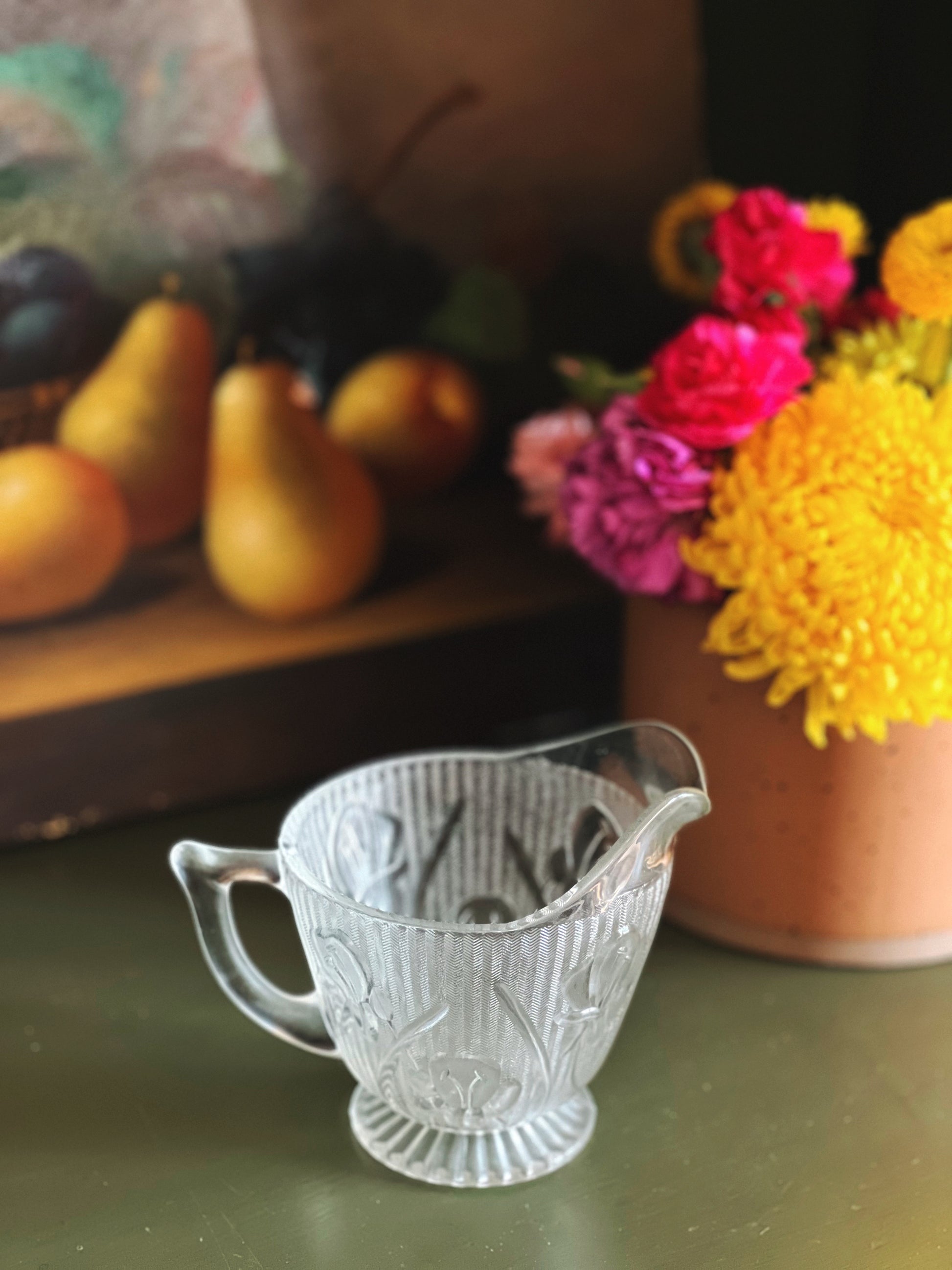 glass creamer with a frosted floral design