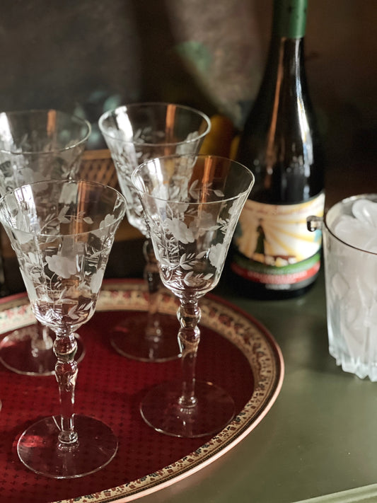 etched wine glasses on a tray