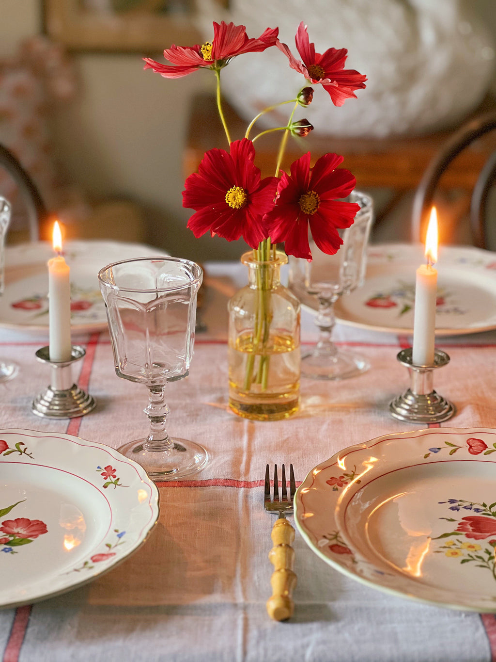 dinner table set with flat panel wine glasses that have a bamboo stem