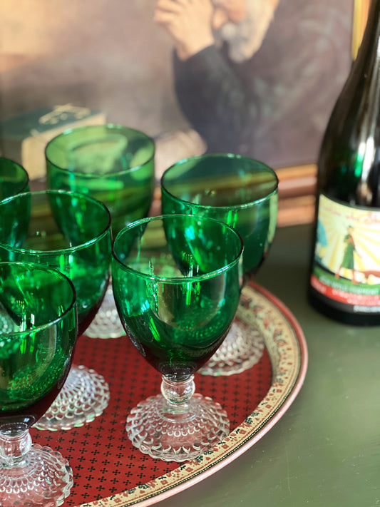 green crystal wine glasses with clear stems